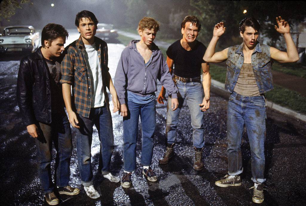 <p>When the Curtis boys are hyping themselves up for the rumble while leaving the house, Tom Cruise does a backflip off of a car in the front yard. Patrick Swayze was coaching Cruise how to do the stunt right before it was filmed, and Cruise was incredibly uneasy. </p> <p>Cruise then approached Hinton, saying he didn't know he could do it because he felt sick from lunch. Hinton then had Cruise drink raw eggs until he threw up, which apparently made him feel better. He then pulled off the flip with no further problems. </p>