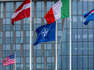 The NATO flag is seen in the centre among the flags of the NATO member countries at the NATO headquarters building on April 27, 2023 in Brussels, Belgium. The alliance is drawing up plans for war with Russia for the first time since the end of the Cold War.