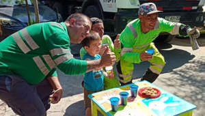 A proud mom has shared the sweet moment her three-year-old son asked if he could share drinks and cookies with his local sanitation workers – even setting up a table for them outside his home. Gabriel Martinez, from Santiago, Chile, has always been fascinated by cars and trucks, mom Nicole said, and when the local garbage truck passes by his house, Gabriel always greets the workers on the street. One day Gabriel asked Nicole if they could purchase some drinks and cookies for the workers, which she happily agreed to, and the pair set up a table for the snacks. As the grateful workers then came by and picked up their cookies, Nicole shot footage she intended to share with her family but ended up going viral with millions of views on social media.