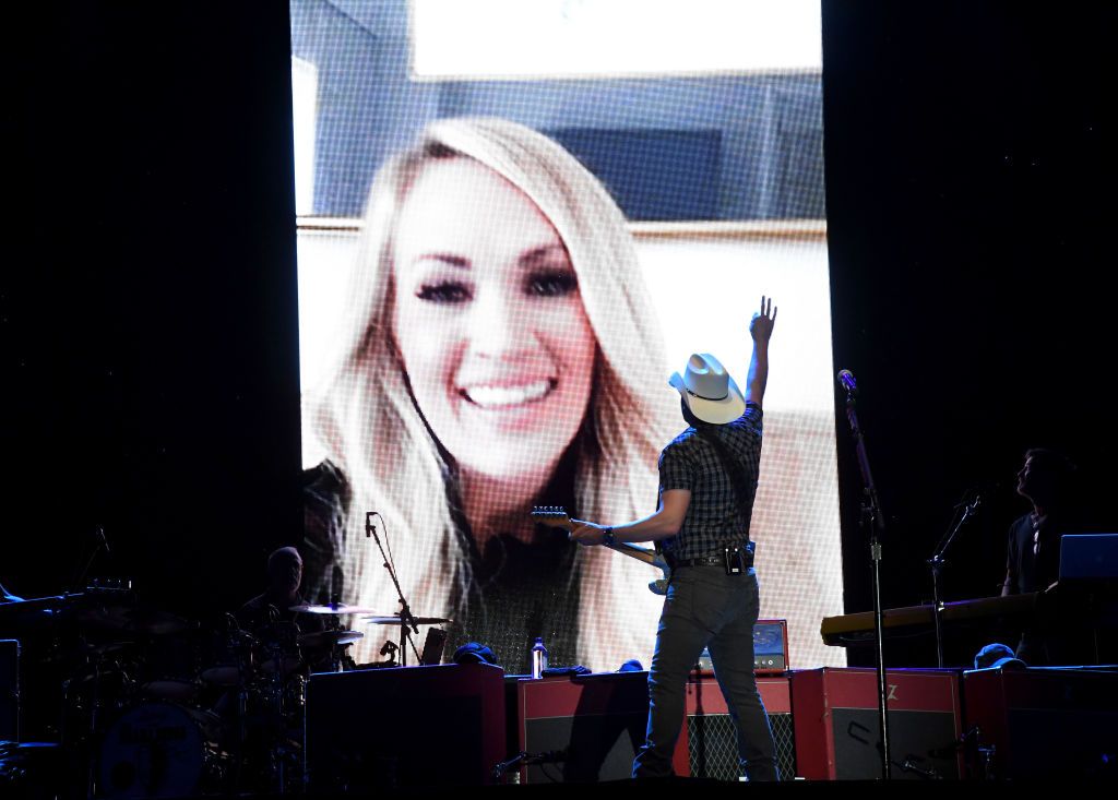 <p>Underwood joined fellow country performer Brad Paisley, virtually during the pandemic, for Live Nation’s <a href="https://etcanada.com/news/667164/carrie-underwood-makes-surprise-appearance-during-brad-paisleys-drive-in-concert/">drive-in concert</a> series, Live From The Drive-In. The two sang their hit song "Remind Me."</p>