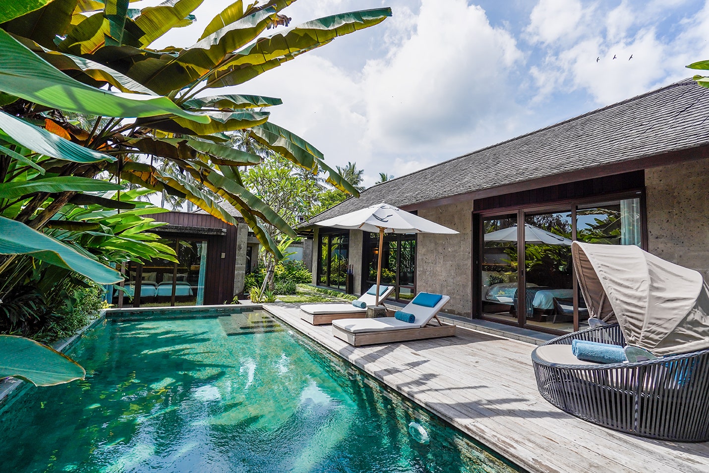 <p><strong>Tabanan</strong></p> <p>Tucked between the rice fields of Tabanan, a little-visited rural enclave on Bali's southwestern coast, Nirjhara feels like a hush-hush hideaway for the island's in-crowd. At the pool, overlooking the hotel's rambling waterfall, you'll find a stylish bunch of linen-clad expatriates, off-duty models, and high-society Indonesians on weekend jaunts from Jakarta. Between poolside sessions, they'll hop to the spa for flower baths or Ayurvedic marma-point massages, stop for yoga classes in the all-bamboo riverside shala, or venture out for trips to the nearby Tanah Lot temple on the complimentary guided bike rides. Nirjhara's lodgings—all straight lines, honey-hued woods, and Indonesian textiles—range from villas with balconies above the river to multi-bedroomed, private-pooled mansions with lush jungle views. If private pools are no priority, consider the Canopy Suites—these stilted tree houses surrounded by a palm grove come with brilliant rooftop decks overlooking the rice fields. And when Tabanan starts to feel a little too isolated, Canggu's buzzy bars and restaurants are just a short drive away.</p> <div class="callout"><p><a href="https://cna.st/affiliate-link/7EaqjGTiGVEZLzw7dtDbaNV19tv3GB292XQUmXXjBeZmXJw4YG2Bg8vEz9PqTk1F9jpiAc24qHdJBXmQSEeWGcNgYj3zXrh3YGQFtpEWNUPhM6RvZ2Te2ePf47aSP155n2NhN87RaqbkYNgJDHKHS" rel="sponsored" title="Book now with Booking.com">Book now with Booking.com</a></p> <p><a href="https://cna.st/affiliate-link/2FTC5bHweKNXngBbWiRH7D5k3FvfWq6GyqH7sx2FXQvGUXwuoGtsV9KTpxMRrYfG5HfHLU8cpJkYykuqvKgXQFmD4NDZZX43oRKsqcyWB52KHomgKxSjy2HFmBygkXgvoJJR6JwSoueToeUE7gpNjTCJjKLtM18mSJbgv2A99ThsRQsZKJoKDskfXfyrQ" rel="sponsored" title="Book now with Expedia">Book now with Expedia</a></p> </div><p>Sign up to receive the latest news, expert tips, and inspiration on all things travel.</p><a href="https://www.cntraveler.com/newsletter/the-daily?sourceCode=msnsend">Inspire Me</a>