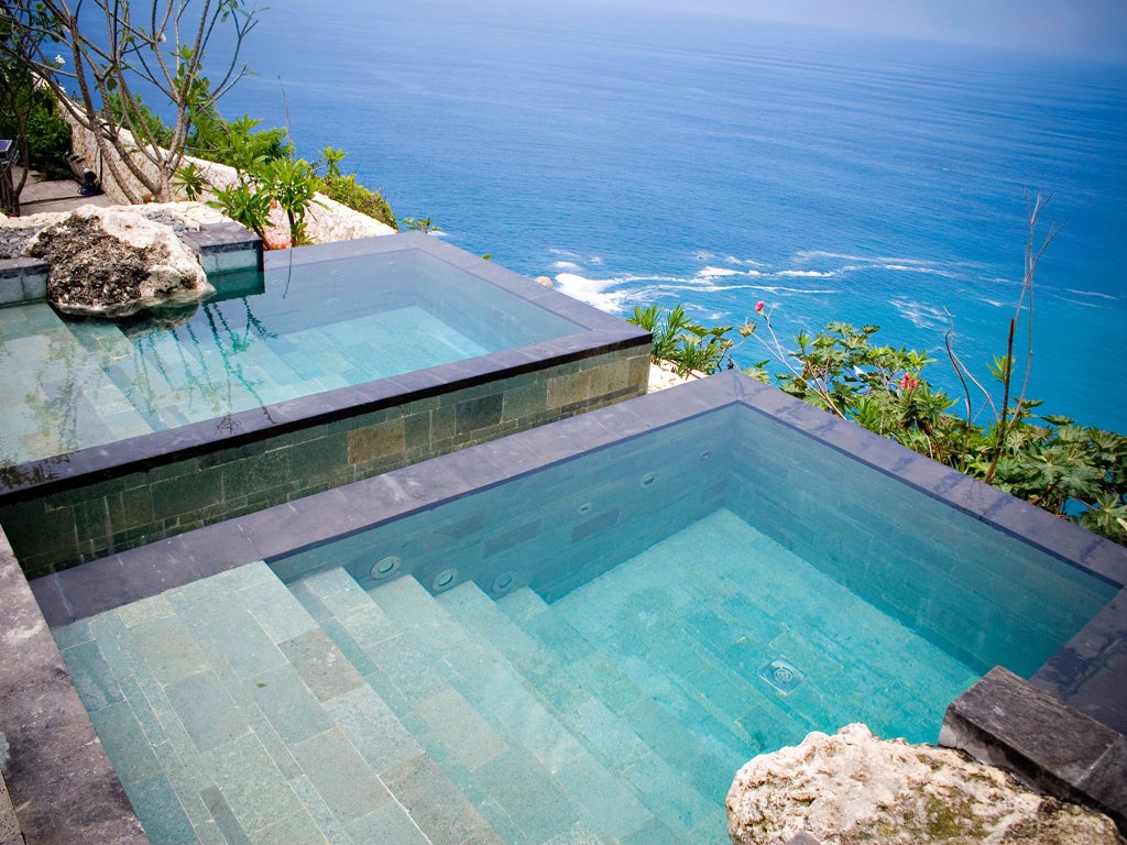 <p><strong>Uluwatu</strong></p> <p>Teetering on a cliff on Bali's rugged southern tip, <a href="https://www.cntraveler.com/hotels/indonesia/ulluwatu/bulgari-resort?mbid=synd_msn_rss&utm_source=msn&utm_medium=syndication">Bulgari Bali</a> is as splendid as you could expect from a brand known for its diamonds and gold. But that's not to say the look is all-out-opulent: the hotel's 59 villas, each with a plunge pool and gardens frothing with bougainvillea, tastefully blend sharp Italian design with Indonesian materials such as mossy volcanic rock, Javanese mahogany, and kaleidoscopic <em>ikat</em> weavings. It's all laid out like one of those small Italian cliffside villages, with cobblestoned pathways connecting the villas to the restaurants—chef Luca Fantin's fine Italian Il Ristorante, and international all-day diner Sangkar—spa, and frangipani-fringed infinity pool. There's even a wedding chapel, and, of course, a Bulgari boutique selling exclusive silks and swimwear. Down at sea level, the rocky beach (accessible via a hair-raising steep Inclinator) is a lovely spot to spend a few hours on the mattress-thick daybeds. Apart from the stunning Uluwatu temple, a 20-minute drive away, there isn't a whole lot to see or do in the area—but considering the hotel's hefty price tag, you might as well make every minute count.</p> <p><em>This article was originally published on <a href="https://www.cntraveller.com/gallery/bali-hotels?mbid=synd_msn_rss&utm_source=msn&utm_medium=syndication">Condé Nast Traveller India</a>.</em></p><p>Sign up to receive the latest news, expert tips, and inspiration on all things travel.</p><a href="https://www.cntraveler.com/newsletter/the-daily?sourceCode=msnsend">Inspire Me</a>