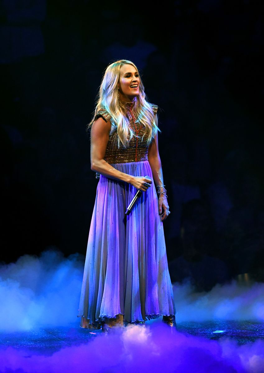 <p>Underwood wore a gorgeous purple and pink chiffon dress to perform in Los Angeles during her Storyteller tour. Her opening acts included Little Big Town, Sam Hunt, Lauren Alaina, and Maddie & Tae.</p>