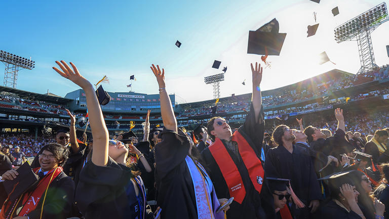 Northeastern University students celebrate at their undergraduate commencement. Getty Images
