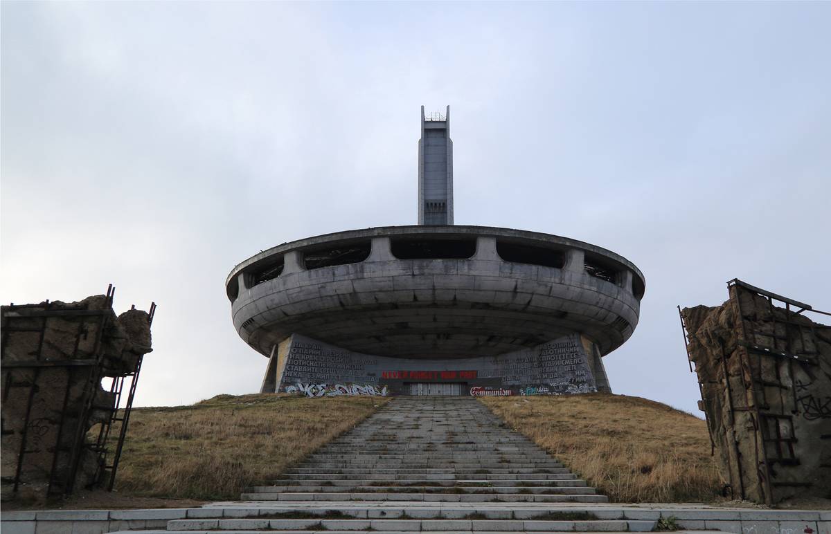 <p>It looks like you're staring at a picture of giant UFO sitting atop a hill in Bulgaria, but it's really just the former Communist Party headquarters. Buzludzha sits on top of a nearly 1500-meter-tall point in the Central Balkan Mountains but hasn't seen use in decades.</p>