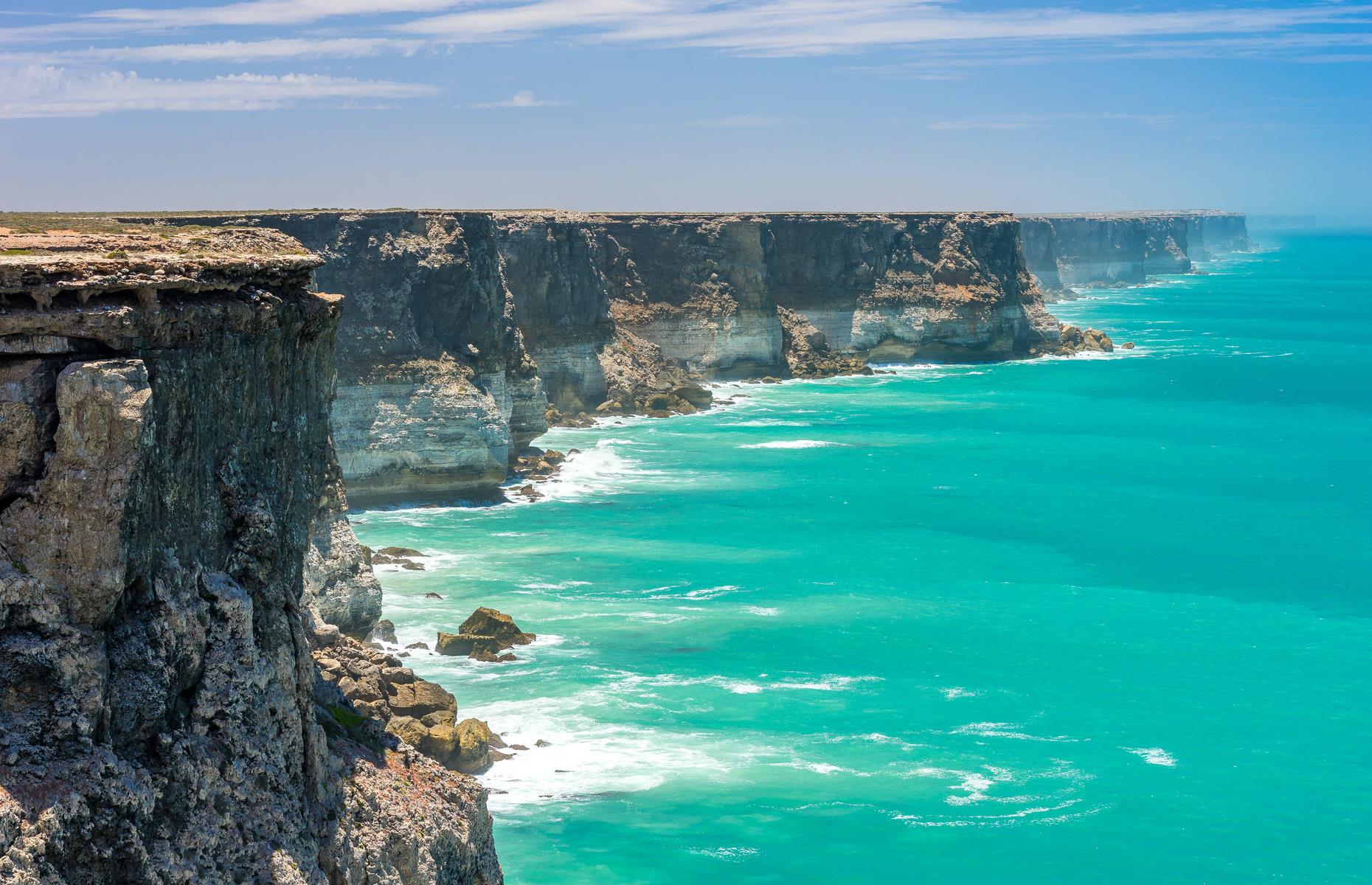 <p>Breathtaking doesn’t begin to cover the view as you stand buffeted by wind on top of the vertical cliffs of the large oceanic bight in South Australia. On the southern edge of the Nullabor Plain, the Bunda Cliffs, which reach heights of between 60 and 100m (200 and 400ft), are one of the park's most spectacular sights. It's also a top spot for watching southern right whales as they migrate between May and October – this is an important calving area for the endangered marine mammals. Around 80% of Australia’s native sea lion population are also found here.</p>