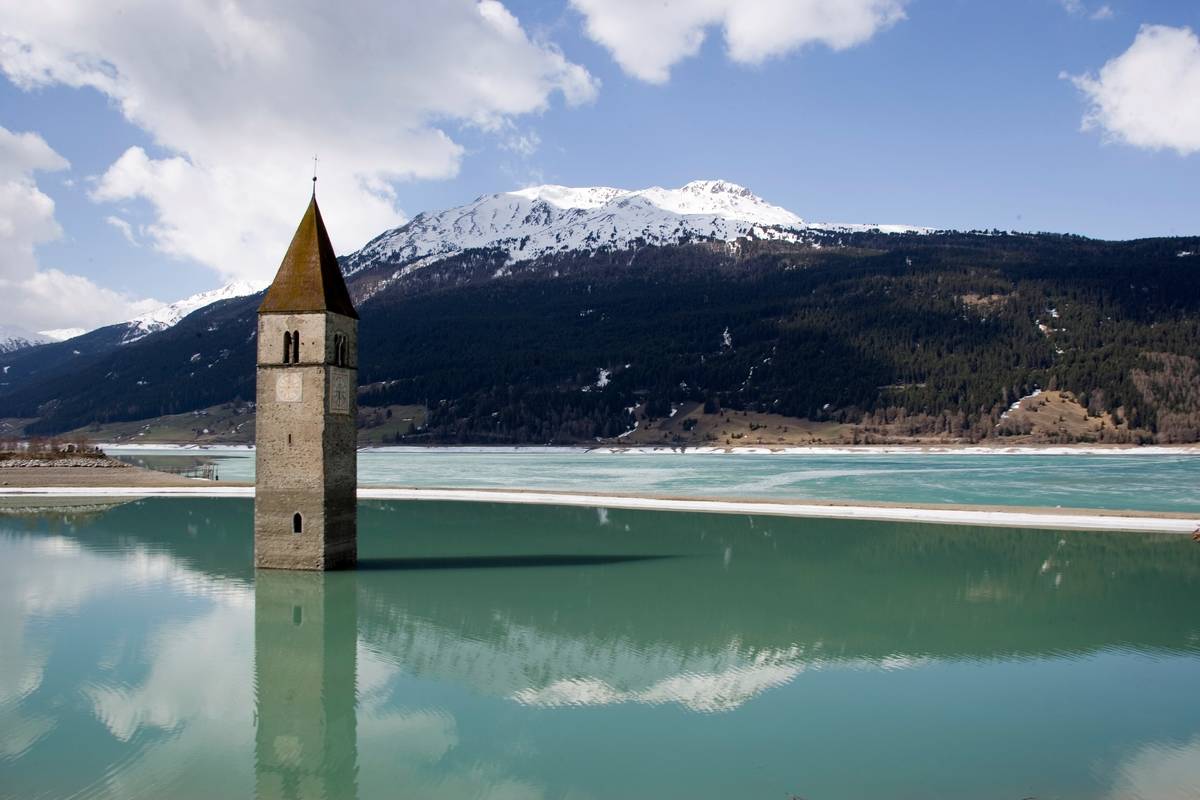 <p>Also known as the lost bell tower of Graun, the bell tower that sits in the center of Italy's Lake Reschen is all that's left of a 14th-century church, and all that's left of the submerged village of Graun. The lake was created in 1950 and demolished or submerged more than 160 buildings. </p>