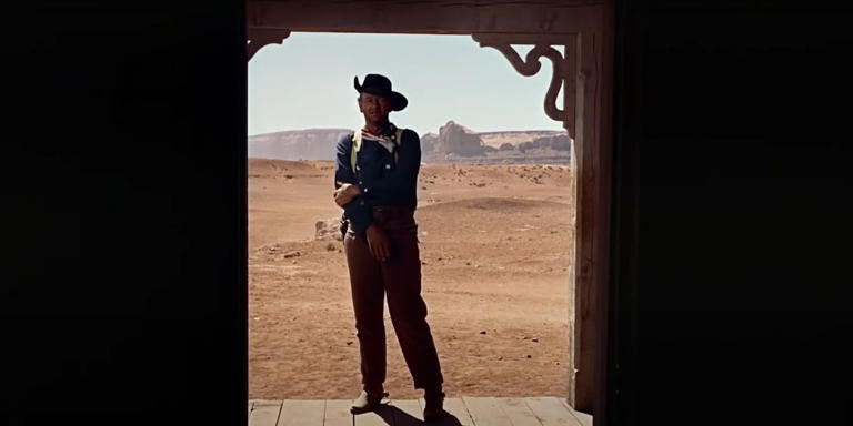 John Wayne as Ethan standing in the doorway in The Searchers 