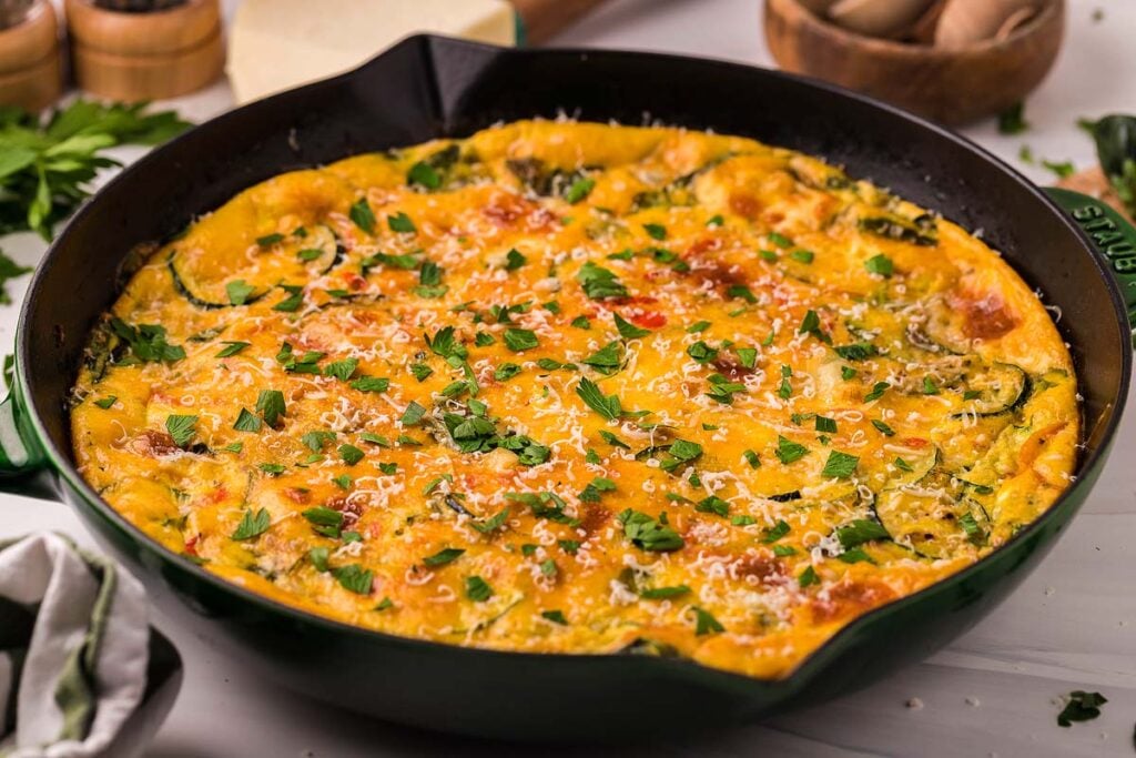 A skillet with an Italian vegetable frittata in it. 