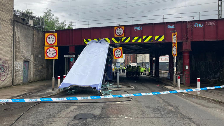Ten in hospital after bus loses roof from hitting railway bridge