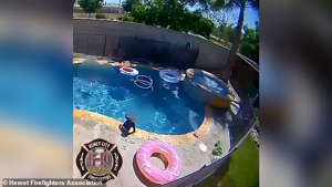 The 40-second video shows the boy walking around the side of the pool before he sits on the edge 