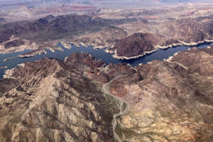 A bathtub ring shows where the water mark on Lake Mead once was along the boarder of Nevada and Arizona, March 6, 2023, near Boulder City, Nev.