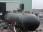 A Virginia-class submarine, SSN-774, leaves an assembly building at the General Dynamics Electric Boat shipyard in Groton, Conn., in this August 2003 file photo.