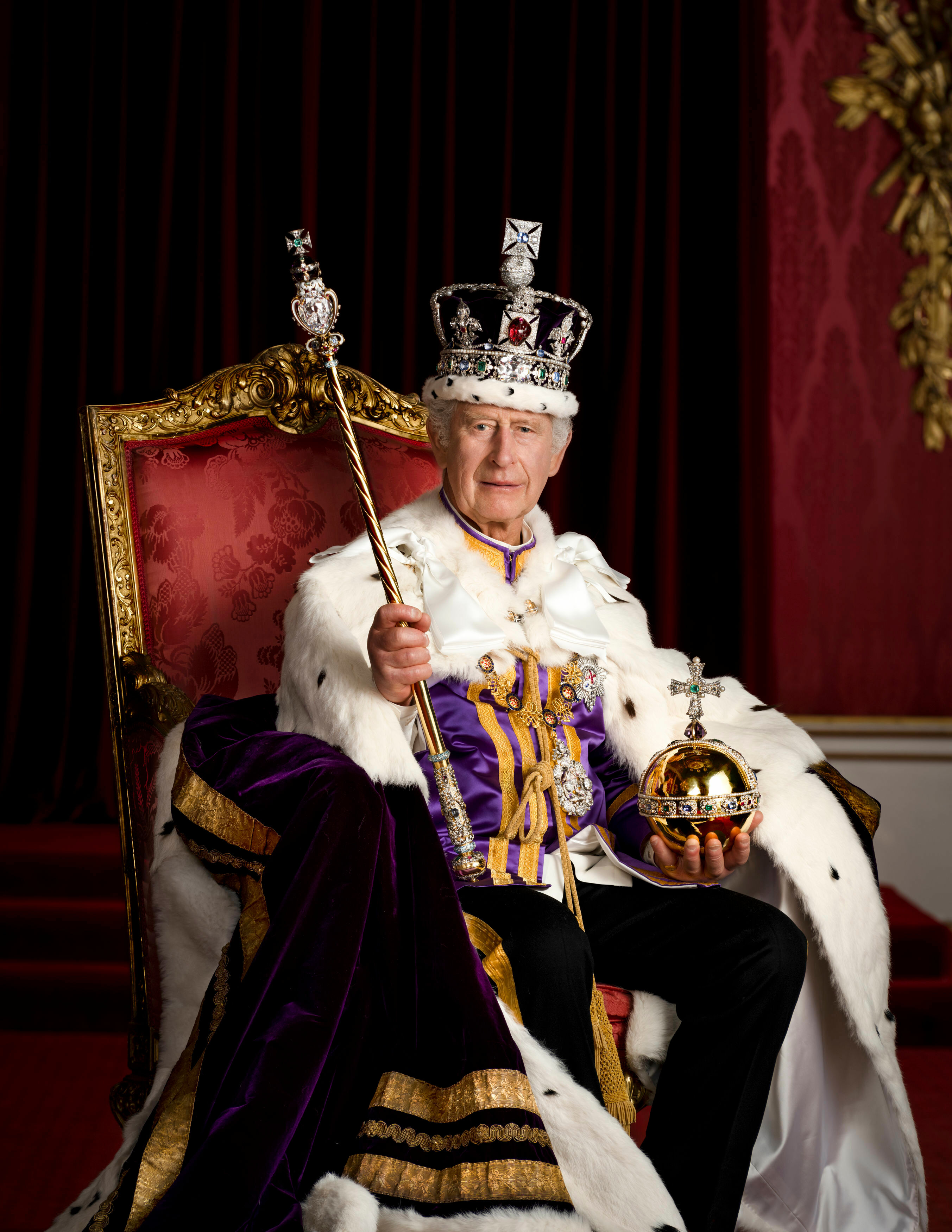 <p>King Charles III is pictured in full coronation regalia in the Throne Room at Buckingham Palace in London in one of four official <a href="https://www.wonderwall.com/celebrity/the-coronation-of-king-charles-iii-and-queen-camilla-the-best-pictures-of-all-the-royals-at-this-historic-event-735015.gallery">coronation</a> portraits released to the public on May 8, 2023. The monarch is seen wearing the Robe of Estate and the Imperial State Crown and is holding the Sovereign's Orb and Sovereign's Sceptre with Cross. He is seated on one of a pair of 1902 throne chairs that were made for the future King George V and Queen Mary for use at the coronation of King Edward VII. These throne chairs were also used in the background of the 1937 Coronation of King George VI and Queen Elizabeth II and by King Charles III and Queen Camilla at Westminster Hall to receive addresses from the Speakers of both Houses of Parliament in 2022.</p>