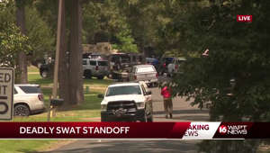 1 officer killed, another wounded in hostage situation