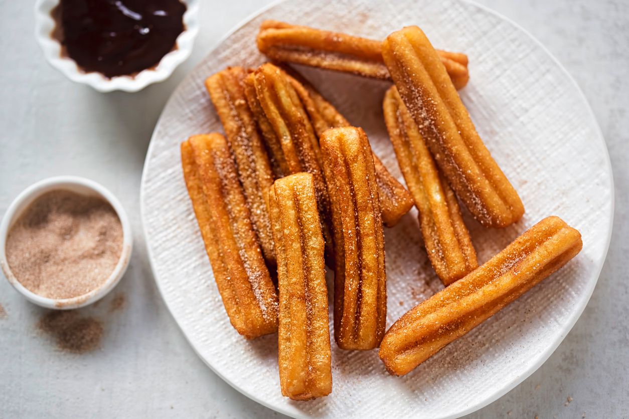 <p>Not a Dole Whip fan? Sacrilege! But fear not: Disney has you covered with another one of its most popular treats: churro bites. Making these chewy tubes of cinnamon-sugar goodness requires only basic pantry baking staples, but you will need a piping bag with a large star tip if you want to achieve their signature shape. </p>   <p><a href="https://www.popsugar.com/food/disney-churro-recipe-47377362">PopSugar</a></p>  <p><a href="https://blog.cheapism.com/fried-food-international/">The Best Fried Foods Around the World</a></p>