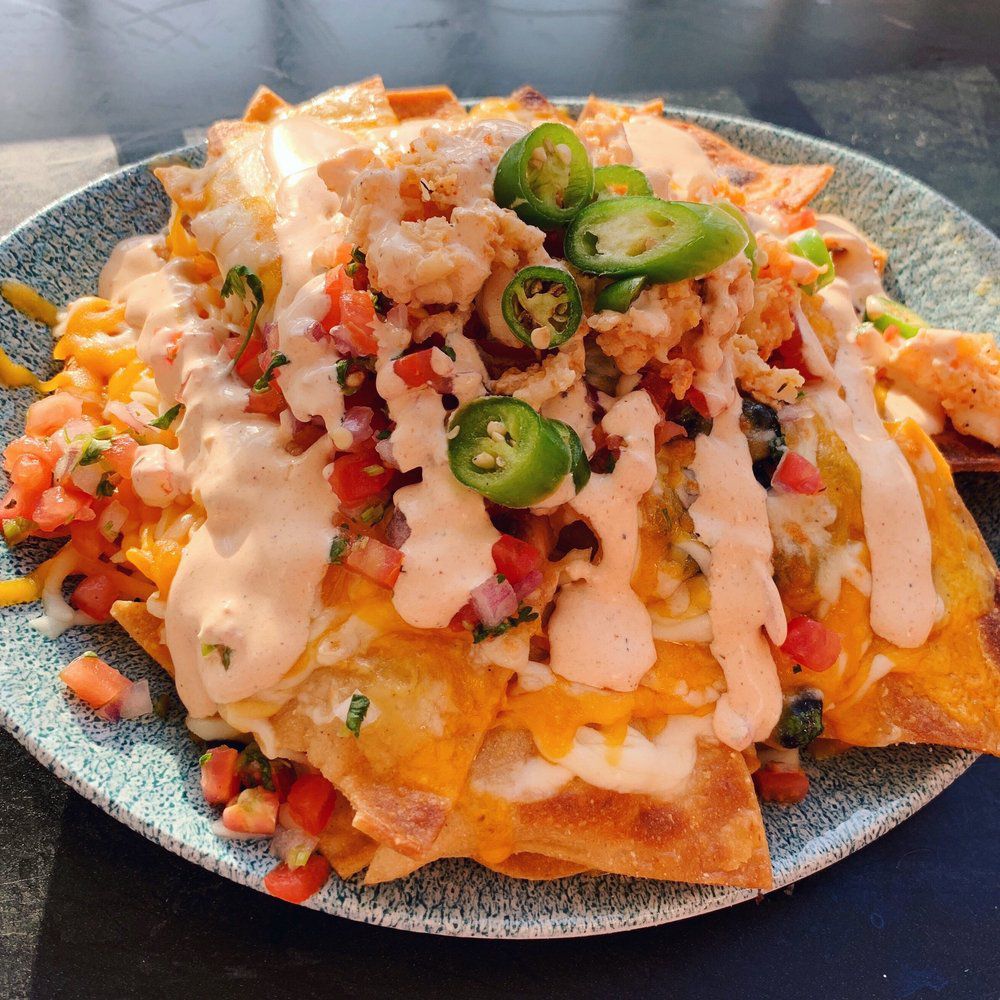 <p>First, the bad news: This recipe for lobster nachos, made at the Lamplight Lounge in Disney California Adventure Park, is pretty involved. Now the good news: They're nachos. With real lobster, homemade pico de gallo and tortilla chips, and chipotle crema.</p>  <p><a href="https://d23.com/lobster-nachos-lamplight-lounge/">D23</a></p>