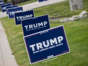 Election signs for Donald Trump are posted in Grimes, Iowa, on Thursday.