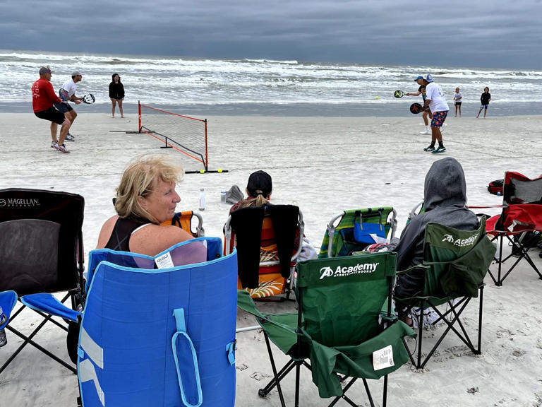 Fans at Butler Beach gathered on a chilly Saturday before Memorial Day to watch the 50th Beach National Pop Tennis Tournament.