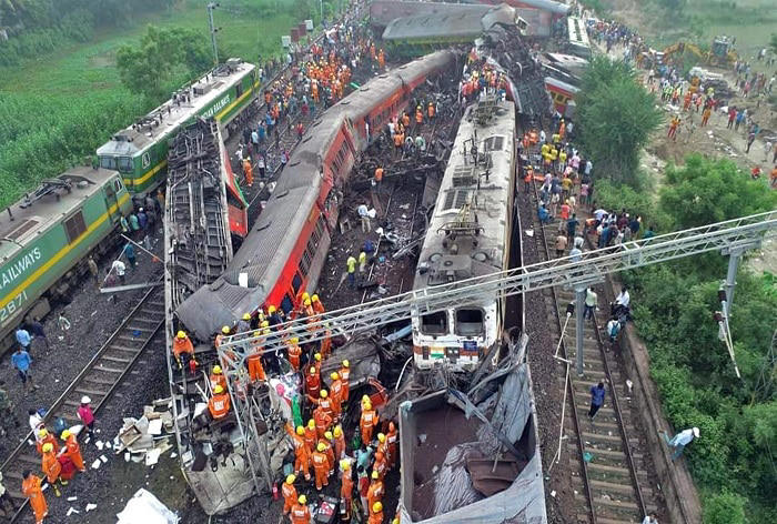 Balasore: Locals, security personnel and NDRF at the site where Coromandel, Bengaluru-Howrah Express trains derailed last night, in Balasore district, Saturday, June 3, 2023. (PTI Photo)