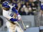 Dodgers star Mookie Betts hits a solo home run  his second of the game  during the sixth inning of their game against the New York Yankees on Friday night at Dodger Stadium. Betts also had two singles in an 8-4 win.