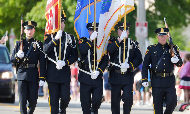 Sheboygan Police Department Color Guard unit marches in the Memorial Day Parade, Monday, May 29, 2023, in Sheboygan, Wis.