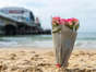 Flowers were left at the beach where Miss Khan died