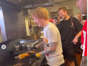 Ed Sheeran in the kitchen of Philip's Steaks.