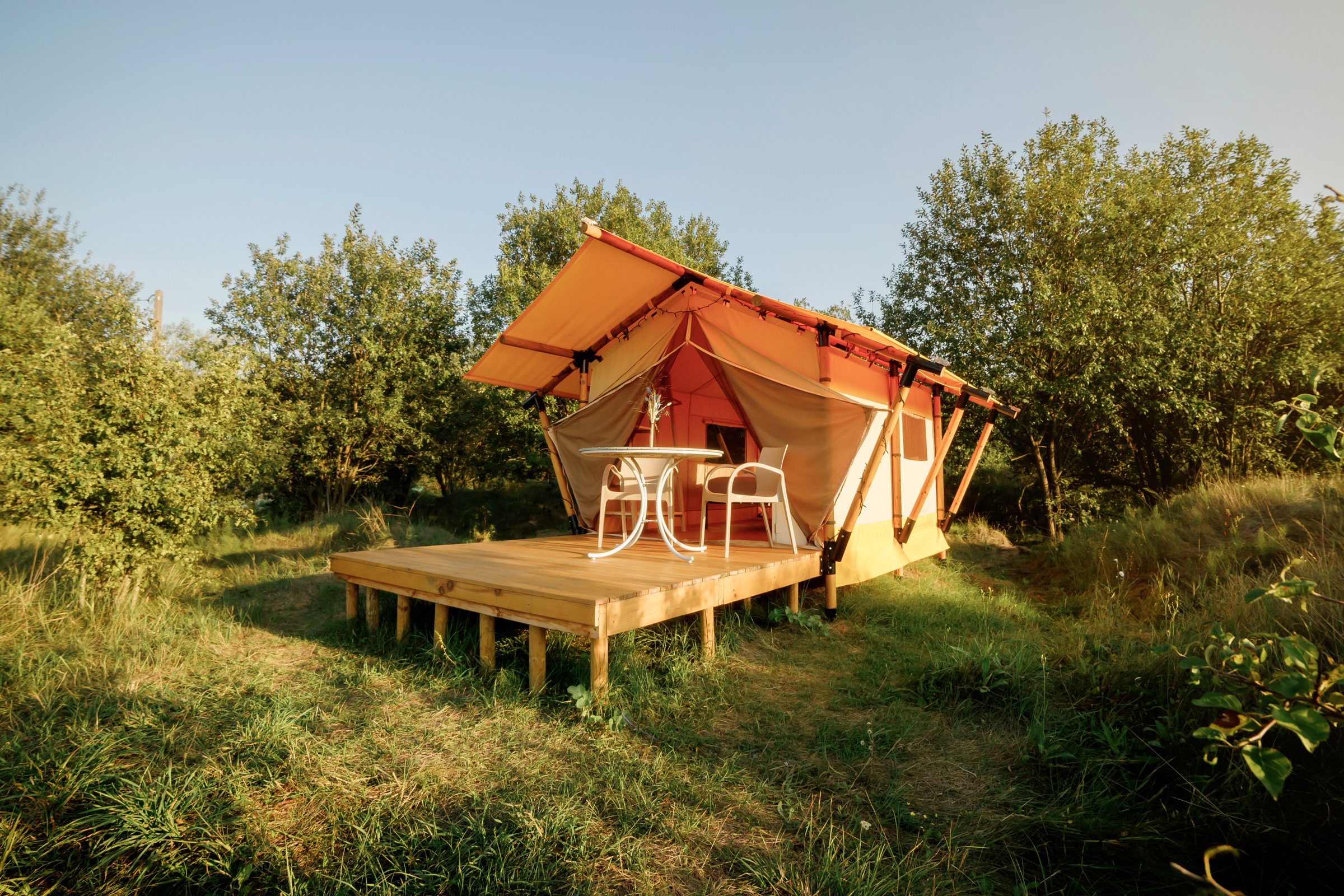 <p>If you long for a vacation filled with natural splendor, stargazing and s'mores<strong>—</strong>but setting up camp and going without a hot shower sound like the stuff of nightmares—glamping is your way to answer the call of the wild. <a href="https://www.rd.com/article/what-is-glamping/">What is glamping</a>, you ask? A portmanteau of "glamorous" and "camping," glamping is luxury camping that allows many creature comforts like running water, flushing toilets, swimming pools, air-conditioning, TVs, high-thread-count sheets, electricity—and the option to stand up straight without banging your head into the top of a tent. Glamping is also an excellent style of camping for beginners who want to dip a toe into appreciating nature without drowning in the deep end of pit toilets and shoe spider checks.</p> <p>And there's a ton of variety with both the setting and the type of accommodation. Canvas safari tents in a wooded wonderland are just the beginning. You could also try <a href="https://www.rd.com/list/yurt-camping/" rel="noopener noreferrer">yurt camping</a> at the beach, an updated Airstream in the desert or a luxe tent on the terrace of a five-star hotel. There are also properties outfitted with treehouses, old-school motorhomes, teepees, vintage circus trailers and transparent bubbles. To help you find the perfect tent that doesn't require you pitching it, we've rounded up the best luxury campsites in North America.</p> <h2>How we chose the best luxury camping sites</h2> <p>This outdoorsy travel trend has been steadily gaining popularity since the early 2000s, so there's no shortage of luxury camping options. But be warned: Not all glampgrounds are created equal. To come up with our list of the best, we sought out the luxury-camping brands that are providing stellar options, scoured star ratings and user reviews, consulted expert recommendations and called on our personal experiences with boutique camping.</p> <p><strong>Get <em>Reader's <b><i>Digest</i></b></em><b>’s</b> </strong><a href="https://www.rd.com/newsletter/?int_source=direct&int_medium=rd.com&int_campaign=nlrda_20221001_topperformingcontentnlsignup&int_placement=incontent" rel="noopener noreferrer"><strong>Read Up newsletter</strong></a><strong> for more travel, humor, cleaning, tech and fun facts all week long.</strong></p>