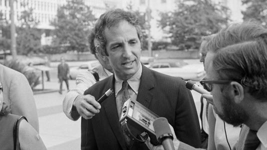 Daniel Ellsberg talks with newsmen as he arrives for arraignment at a Los Angeles, Calif., federal courthouse, Aug. 16, 1971. Bettmann via Getty Images, File