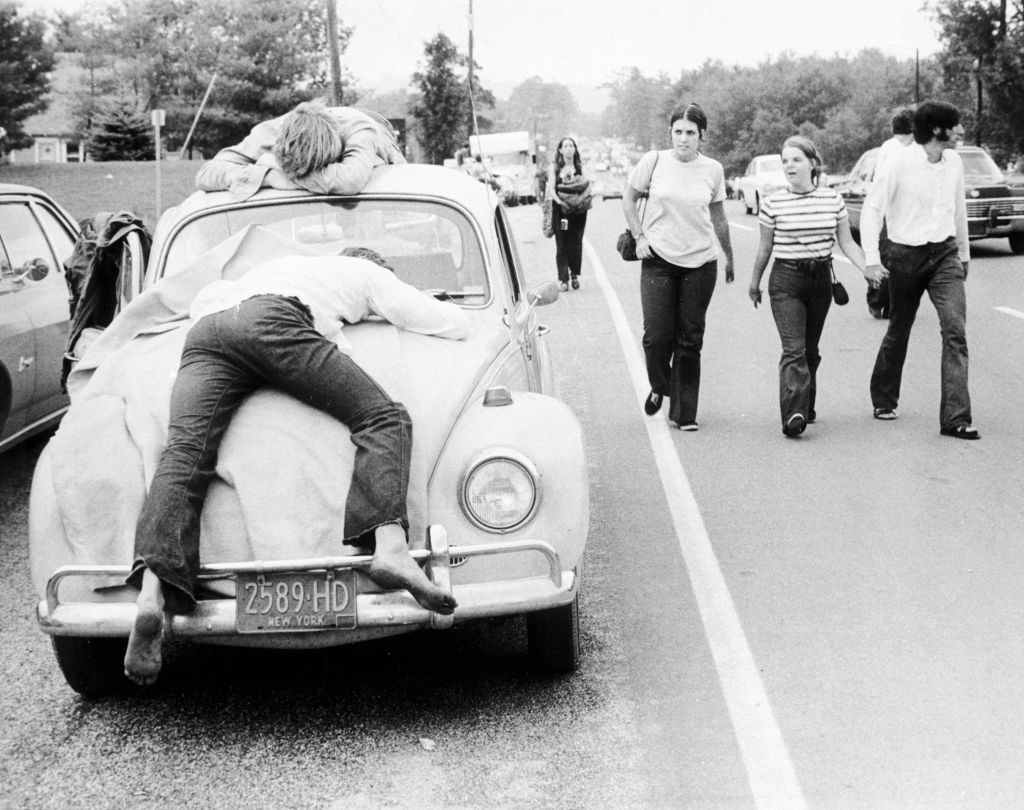 <p>Pictured above are two exhausted festival-goers from Woodstock passed out on the bonnet and roof of their Volkswagen Beetle in 1969. During the '60s, the Beetle was extremely popular among those who embodied a counter-culture lifestyle. They loved its simple design as well as its price.</p> <p>At the time, the Beetle cost less than $2,000 -- a real bargain. In addition, the Beetle got really good mileage. The only downside is that the earlier models were a little slow. They struggled to get past 62-65 mph. </p>