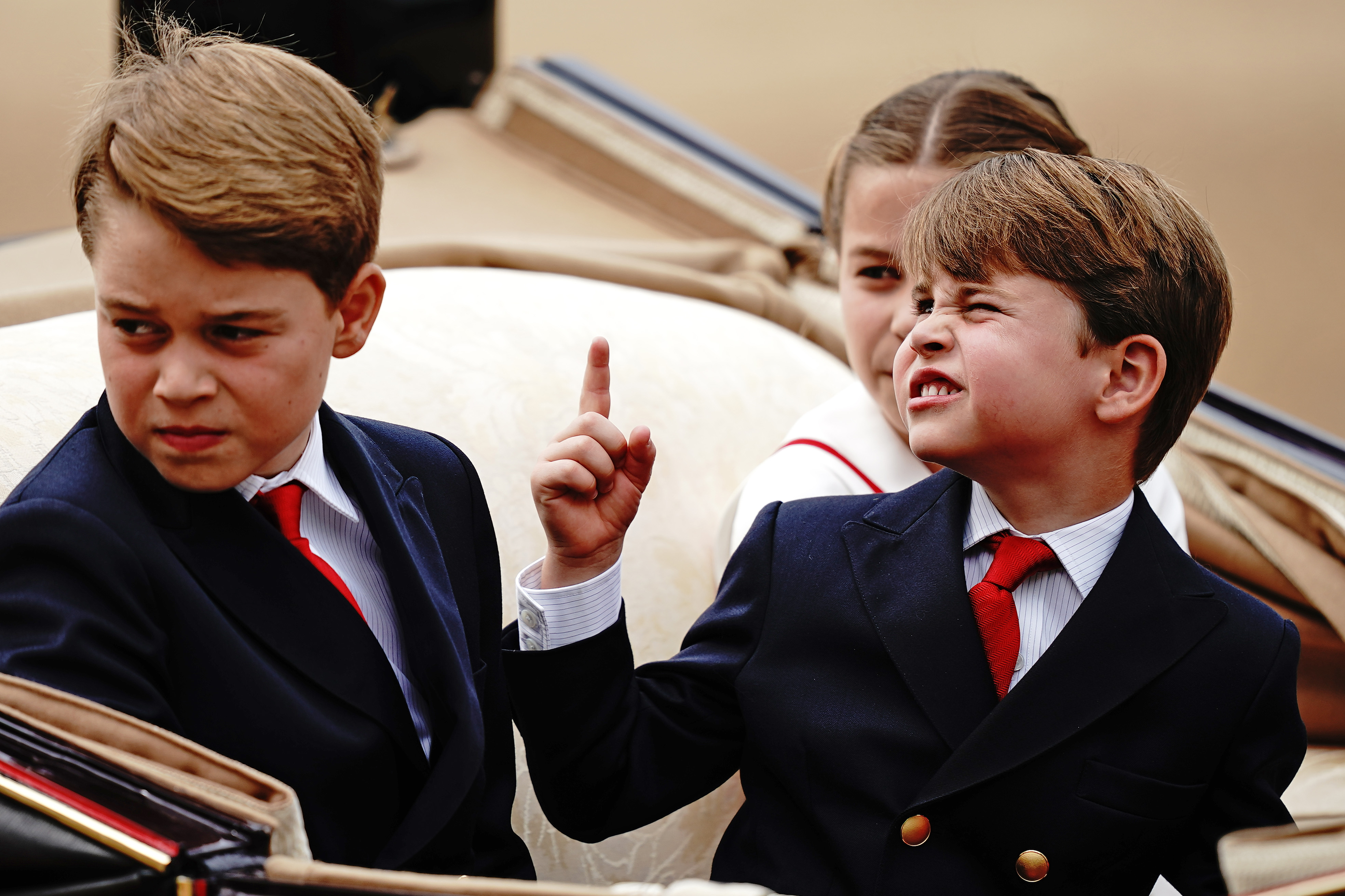 <p>Prince Louis pointed at something while riding in a carriage with siblings Prince George and Princess Charlotte during <a href="https://www.wonderwall.com/celebrity/royals/trooping-the-colour-2023-king-charles-iii-celebrates-the-first-of-his-reign-752078.gallery">Trooping the Colour</a> in London on June 17, 2023.</p>