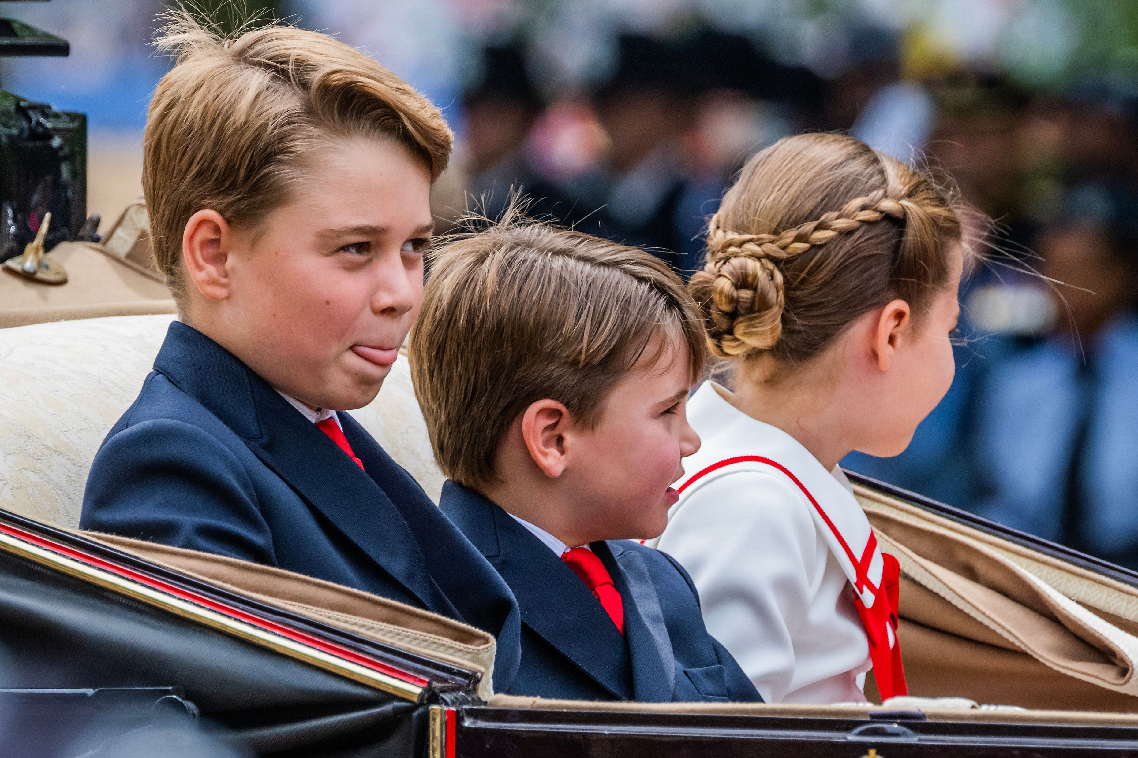 <p>Prince George stuck out his tongue while riding in a carriage with Prince Louis and Princess Charlotte during <a href="https://www.wonderwall.com/celebrity/royals/trooping-the-colour-2023-king-charles-iii-celebrates-the-first-of-his-reign-752078.gallery">Trooping the Colour</a> in London on June 17, 2023. </p>