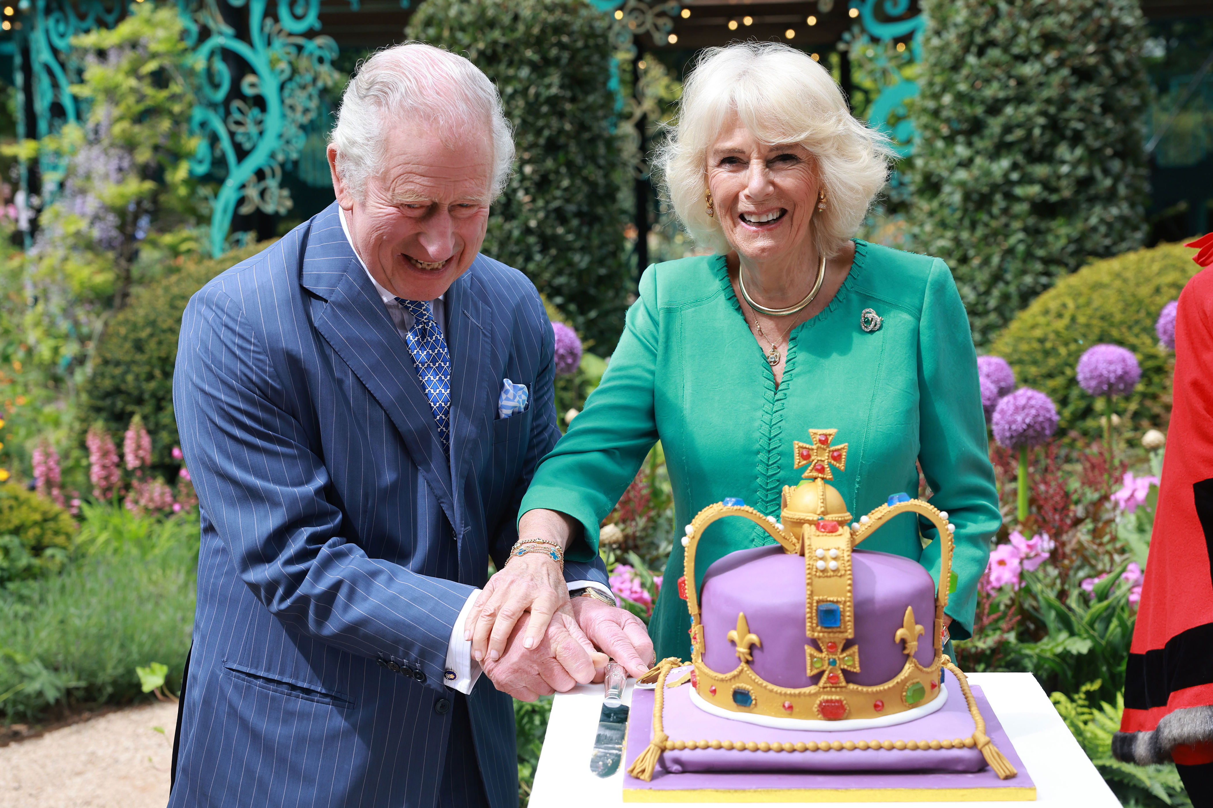 <p>King Charles III and Queen Camilla laughed as they cut a crown-shaped cake during a visit to open the new Coronation Garden in Newtownabbey, Northern Ireland, on day one of their two-day visit to the British nation on May 24, 2023 -- their first since their recent <a href="https://www.wonderwall.com/celebrity/the-coronation-of-king-charles-iii-and-queen-camilla-the-best-pictures-of-all-the-royals-at-this-historic-event-735015.gallery">coronation</a>.</p>