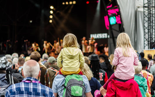 Children watching concert at festival - Getty/iStock