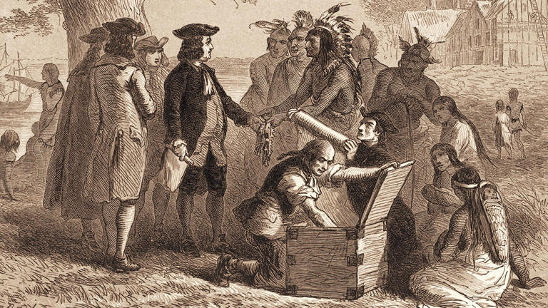 William Penn (1644-1718) accepts a belt from Tamanend (1628-1698), chief of the Lenni-Lenape, as part of a treaty in which Penn purchased a section of land for the Pennsylvania colony, 1682. Stock Montage/Getty Images