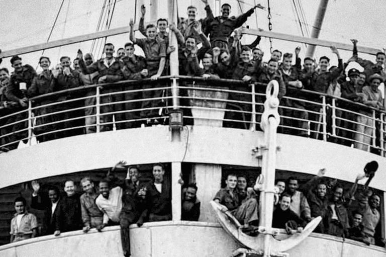 HMT Empire Windrush with people from the Caribbean who answered Britain's call to help fill post-war labour shortages on arrival at the Port of Tilbury on the River Thames