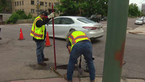 Crews fill potholes around Denver but rain hampers efforts for repairs