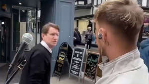 Busker gets into heated row with raging sandwich shop owner