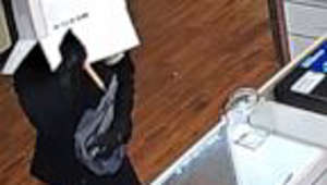 Surveillance video shows box-wearing bandit burglarizing Florida grocery store