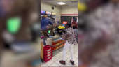 Cell phone video shows people throwing items and fists at two female convenience store employees who refused to sell a cigar to an underage person.