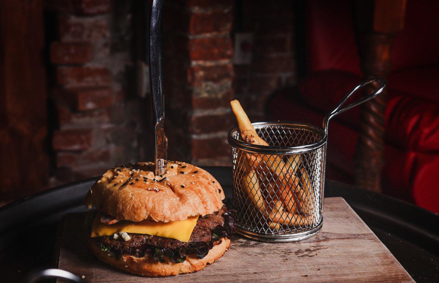 <p>The menu at <a href="https://www.elmesondelos3magos.com.mx/">El Mesón de los 3 Magos</a> in Mexico is packed with Potter-themed options, from drinks to desserts, as well as main meals. The (thankfully owl free) Hedwig Burger brings Potter fans a generous helping of grilled bison meat nestled in a fluffy brioche bun and topped with bacon, lettuce, tomato, Cheddar cheese and pickles. </p>