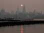 Buildings in the Manhattan skyline shrouded in smoke from Canada wildfires at sunrise in Jersey City, New Jersey, US, on Wednesday, June 7, 2023. New York was the most polluted major city in the world on Tuesday night, as smoke from Canadian wildfires blanketed the city in haze, according to the IQAir website.