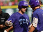TCU designated hitter Kurtis Byrne, center, celebrates with teammate Anthony Silva, #5, after hitting a solo home run against Arkansas during the eighth inning of an NCAA college baseball tournament regional championship game in Fayetteville, Arkansas, Monday, June 5, 2023.