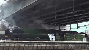 Famous locomotive The Flying Scotsman departs from Paddington Station