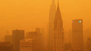 Mesmerising drone footage shows New York skyline blanketed in orange haze