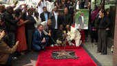 Moment Tupac's Hollywood Walk of Fame star revealed as rapper posthumously honoured