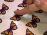 Brianca Thornton's video showcases her extraordinary talent in crafting stunning Polymer clay monarch butterflies using a technique called clay canes. With this method, she expertly creates intricate patterns and designs within the clay, resulting in breathtakingly realistic butterflies. The butterflies, once crafted, are then transformed into exquisite earrings.Throughout the video, you witness the mesmerizing process of transforming raw clay into delicate and vibrant butterfly wings. Location: Missoula, Montana, USA                            WooGlobe Ref : WGA210567For licensing and to use this video, please email licensing@wooglobe.com