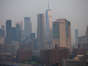 The Manhattan skyline is seen during sunrise amid hazy conditions due to smoke from the Canadian wildfires on June 08, 2023.