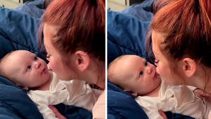 Mom preciously gives her baby loving kisses